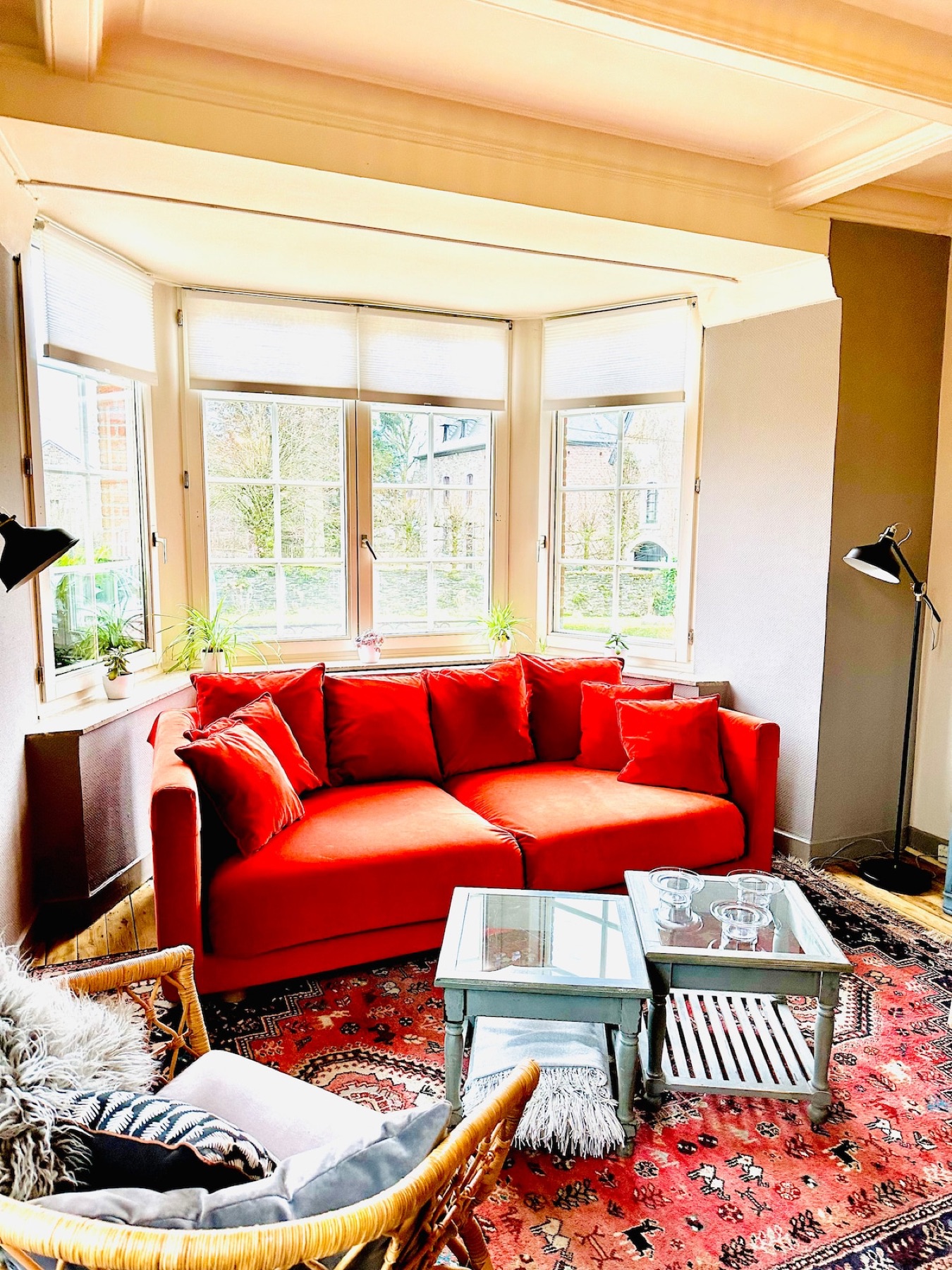 Le Cottage living room with red sofa