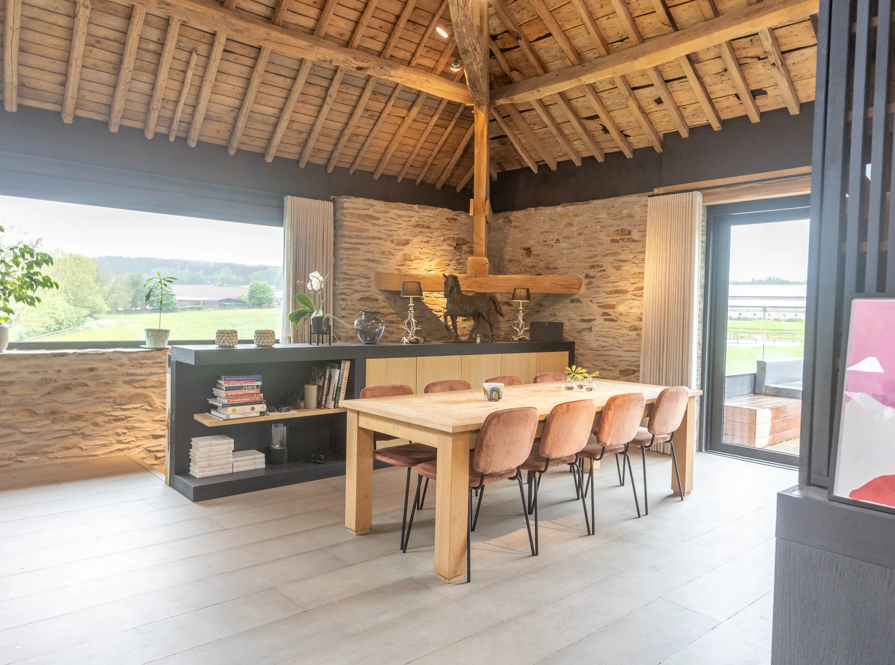 Dining table beneath the timber beams