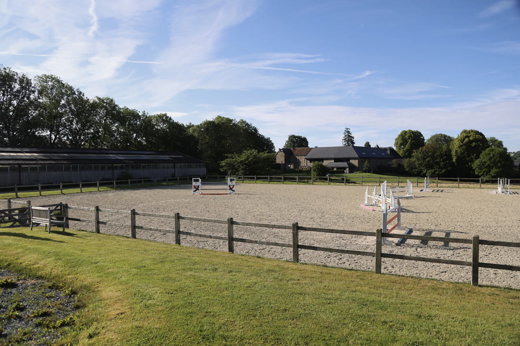 Outdoor riding arena with show-jumping fences